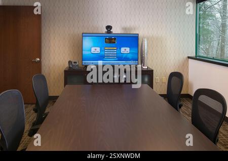 Empty office meeting room with monitor for remote meeting capabilities Stock Photo