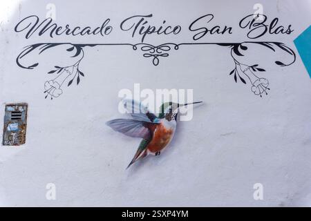 Colorful mural of a hummingbird at the traditional San Blas market in Cusco Peru Stock Photo