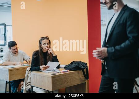 High school students attentively participating in classroom activities Stock Photo