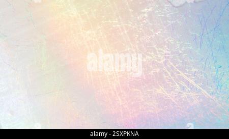 Scratched foil texture with iridescent hues creating a subtle, colorful background. Stock Photo