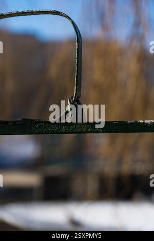 Iron, old handrails with a lock on them. Love lock on the railing Stock Photo