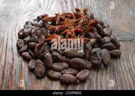 Broken dark chocolate and cocoa beans on the table Stock Photo