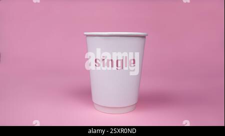 Single cup isolated on pink background. Stock Photo