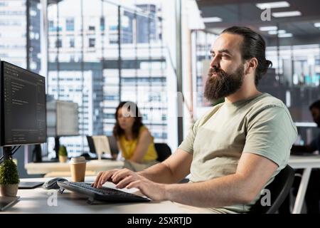 Data scientist doing software quality assurance, reading source code on computer before implementing it. IT employee in office inspecting coding on PC device, looking to fix potential issues Stock Photo