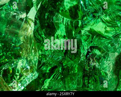 surface of a broken piece of green glass boulder, abstract background Stock Photo