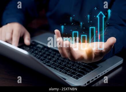 Holding a digital marketing growth graph, analyzing business planning, and conducting financial research on the global network connection. business st Stock Photo