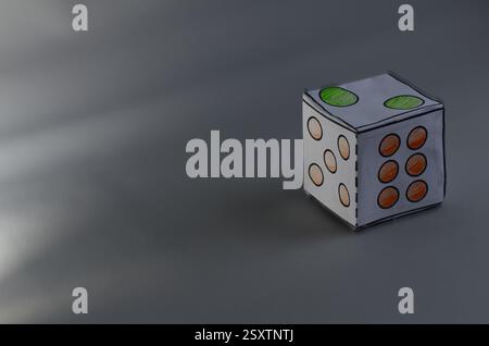 Handcrafted Paper Dice On a Minimalistic Dark Background Stock Photo