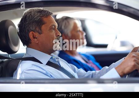 Driving, road trip and senior couple with journey, retirement and together with vehicle. Pensioner, mature woman and old man with transportation, car Stock Photo