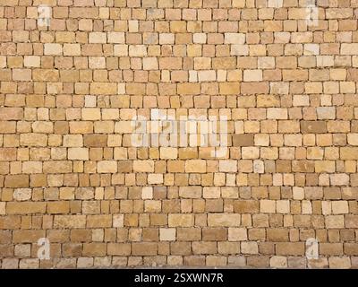 Close-up of a regular yellow limestone brick wall in Riyadh, Saudi Arabia Stock Photo