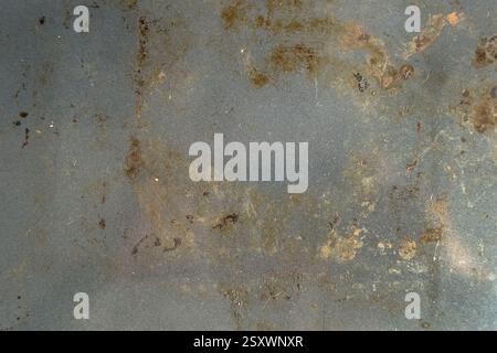 Rusty metal surface with oxidized stains and corroded patches. Aged industrial texture. Rough weathered details. Abstract background Stock Photo