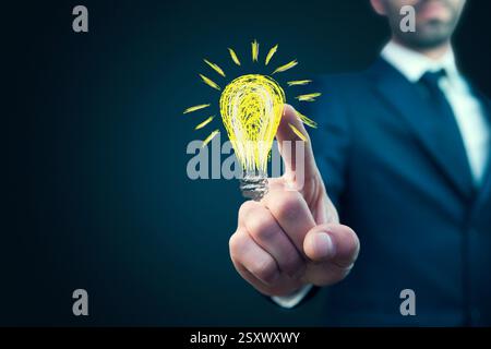 businessman pressing button with idea on virtual screens Stock Photo