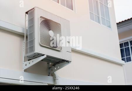 Heat pump or large air conditioning placed on wall of modern house. Energy concept. Stock Photo