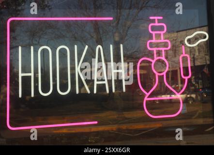 Neon Hookah Sign in Window of Vape Shop Stock Photo