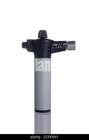 a handheld butane torch for kitchen use on a white background Stock Photo