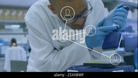 Image of media icons over biracial male scientist doing experiments in lab Stock Photo