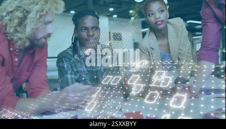 Image of binary coding over diverse business people talking in office Stock Photo