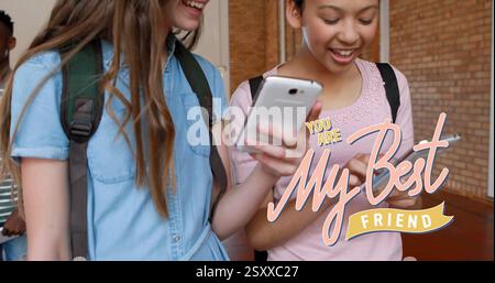 Image of you are my best friend text over diverse female friends using smartphones Stock Photo