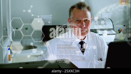 Image of data processing over caucasian male scientist using laptop in lab Stock Photo
