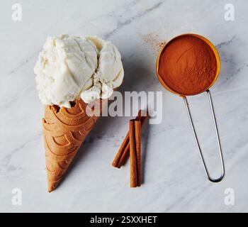Vanilla ice cream on a cinnamon cone Stock Photo