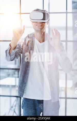 Businessman using vr glasses to view educational material and financial documents Stock Photo