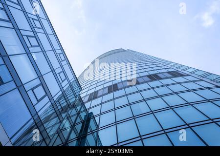 bottom up view of modern glass skyscraper Stock Photo