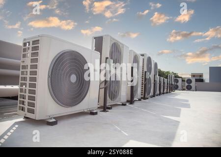 air conditioning and ventilation systems are installed on the roof of an industrial building. Stock Photo