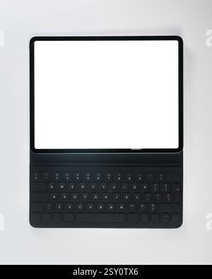 computer laptop tablet empty white screen mockup top white background above desktop display mobile device Stock Photo