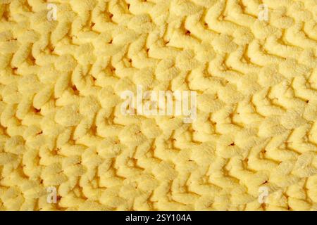 Winter wool hand-knit yellow sweater. Clothes textile background Stock Photo