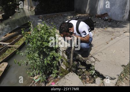 Man drinking water from tap, Srinagar, jammu Kashmir, india, asia Stock Photo