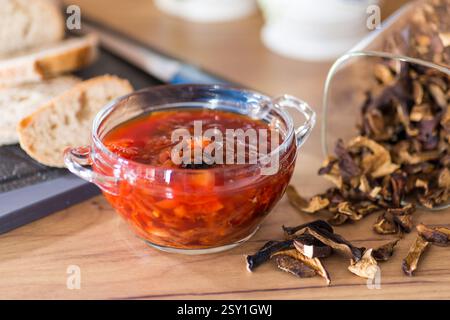 hot lean lunch in glass bowl on wooden table. Stock Photo