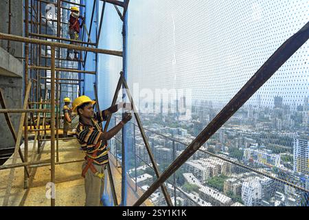 Workers working buildings construction in mumbai central area, Bombay Mumbai, Maharashtra, India NOMR Stock Photo