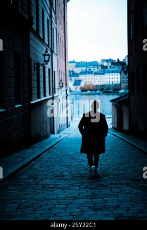 Silhouette of a young man in Stockholm Stock Photo