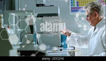 Image of data processing with molecules and brains over caucasian male scientist working in lab Stock Photo