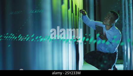 Image of data processing over biracial male worker in server room Stock Photo