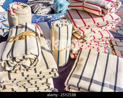 Linen tea-towels and cloths on market stall - Loches, Indre-et-Loire (37), France. Stock Photo