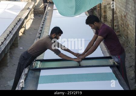 Workers engaged in cloth printing work Bikaner Rajasthan India Asia Stock Photo