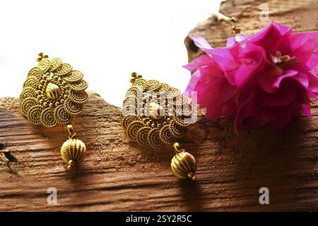 Beautiful Golden pair of earrings, Luxury female jewelry, Indian traditional jewellery, indian jewellery Bridal Gold earrings wedding jewellery Stock Photo