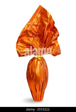 Easter chocolate egg wrapped in sparkling paper orange colored with yellow ribbon isolated on white with clipping path included Stock Photo