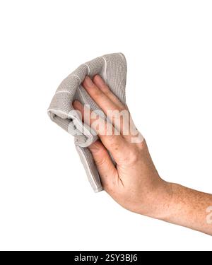 Female hand holding grey microfiber cloth isolated cutout on white Stock Photo