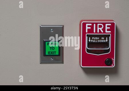 Fire alarm pull box and a push to exit button Stock Photo