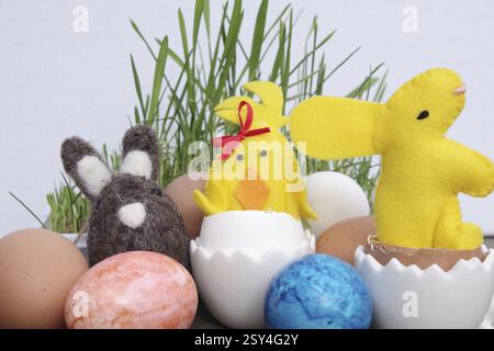 Easter, Easter decoration, Easter egg, Easter bunny, colourful, Coloured eggs and figures lie decorated on a table Stock Photo