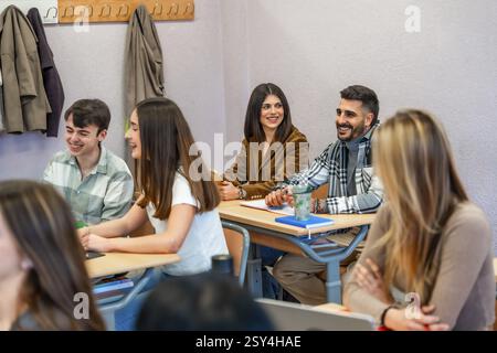 Cheerful university students enjoying their time in the classroom, actively participating and engaging in the learning process Stock Photo