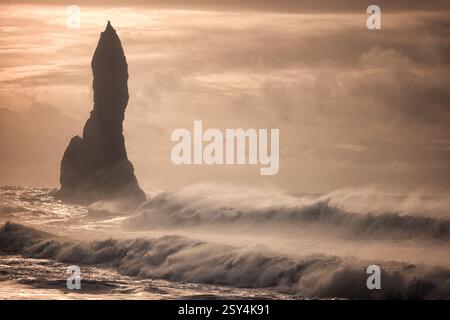 Scenic view of the dangerous big waves at Reynisfjara Beach near Vik on Iceland at sunset - Travel Image Stock Photo