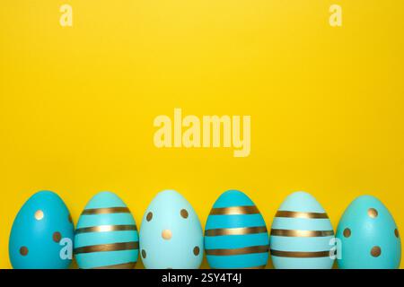 Empty yellow background with Easter eggs Stock Photo