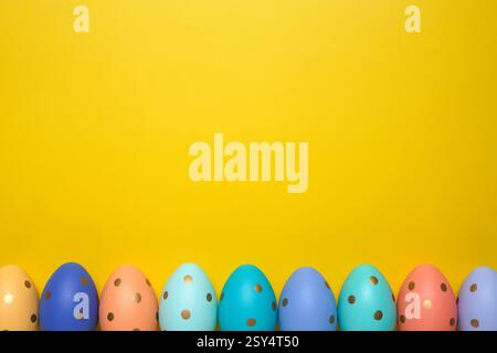 Empty yellow background with Easter eggs Stock Photo
