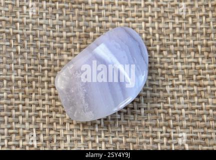 Blue Agate, sapphirine mineral gem stone on black background, blue chalcedon close up Stock Photo
