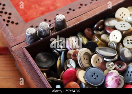 many old buttons are in a box Stock Photo