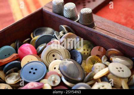 many old buttons are in a box Stock Photo