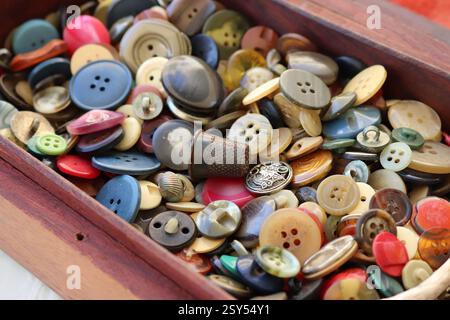 many old buttons are in a box Stock Photo