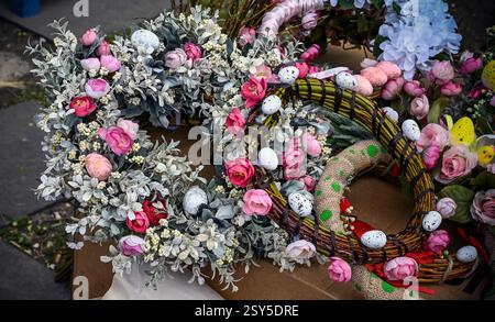 Decorative Easter garlands with flowers and painted eggs Stock Photo